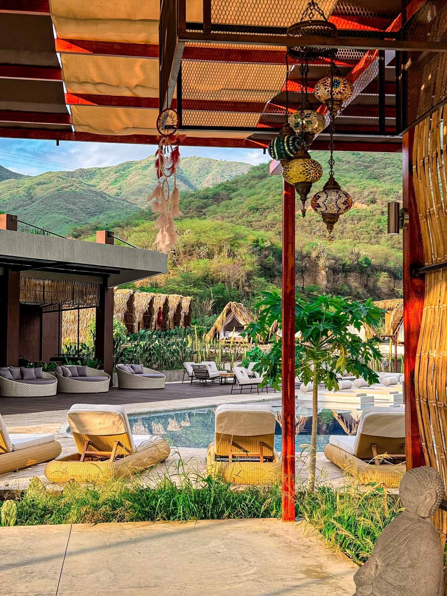 Biohotel pool terrace with hanging hammocks mountain views - Relaxation area tropical dry forest Nariño